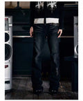 Madonna-style denim jeans with rivet holes