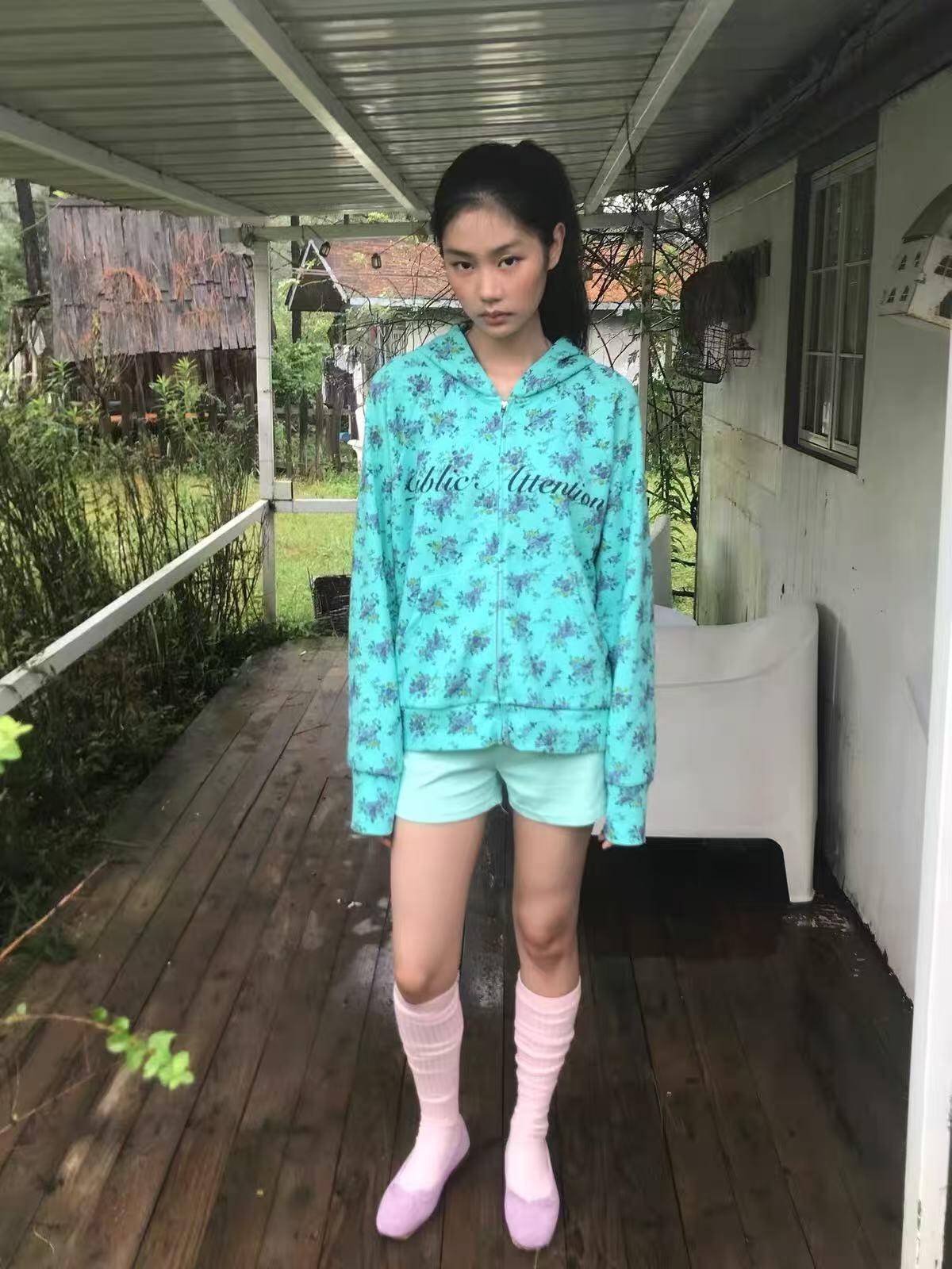 Mint floral print zip-up hoodie with Public Attention graphic