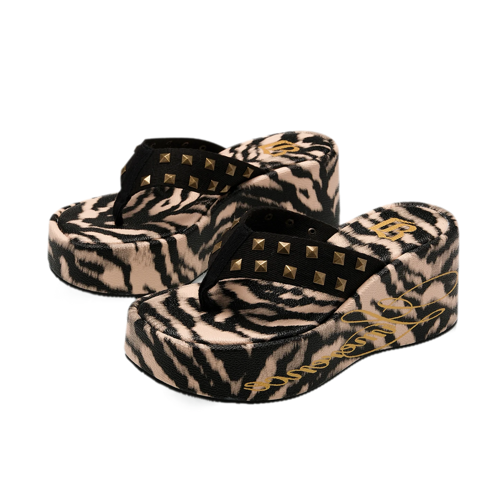 Studded animal print slides in tiger stripe