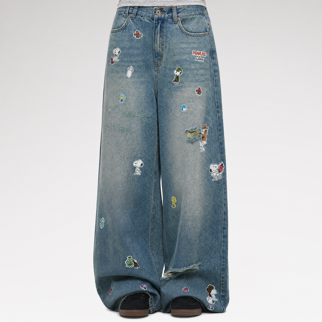 Washed distressed wide-leg jeans with patches