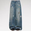 Washed distressed wide-leg jeans with patches