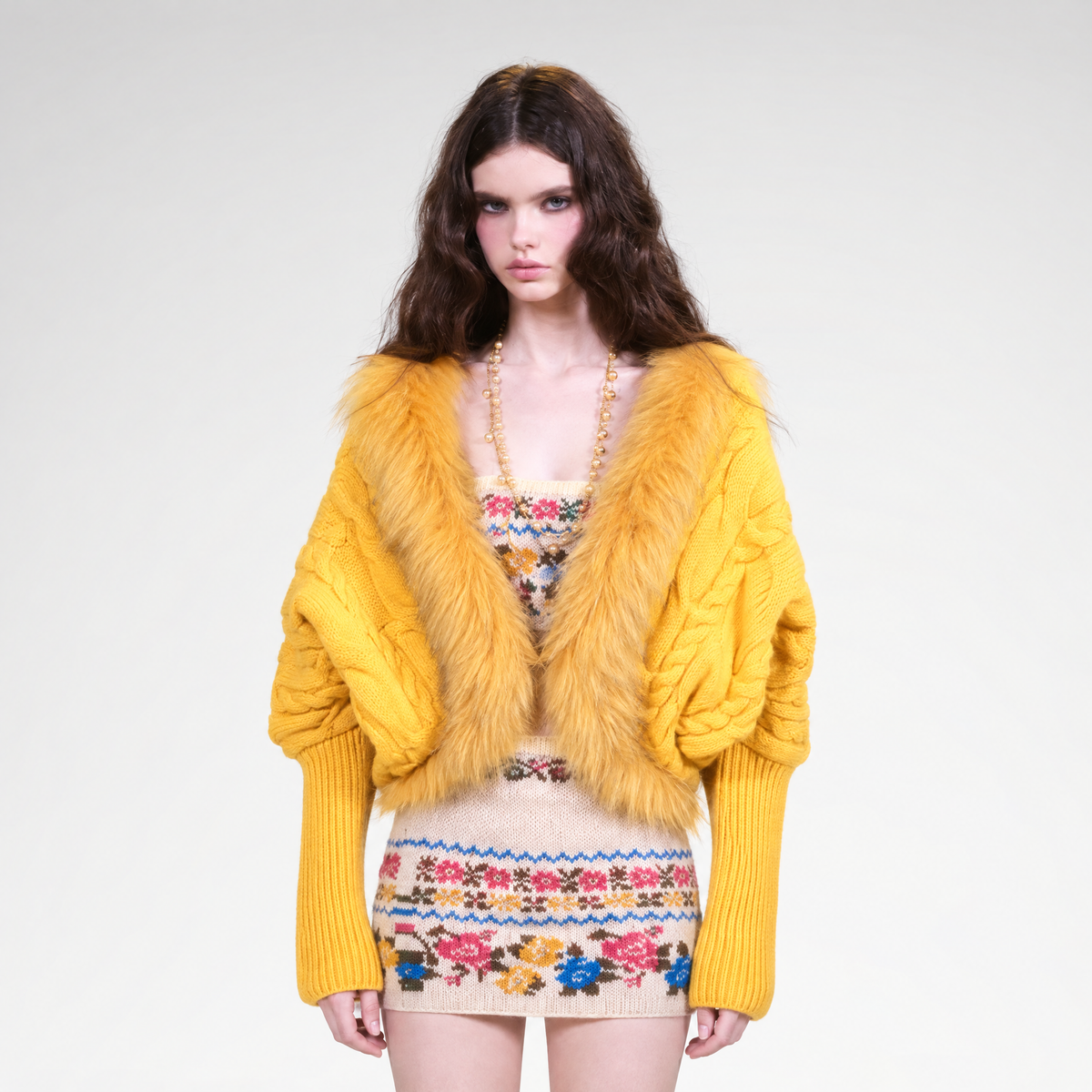 Cable knit batwing wool cardigan with fur trim in purple and yellow